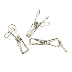 Three reusable metal clothes pegs made from stainless steel on a white background