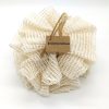 Cream ramie bath puff with Save Some Green tag on a white background