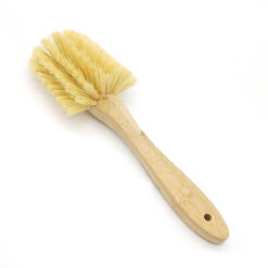 Back view of bamboo and sisal fan brush with pale bristles and bamboo handle on a white background