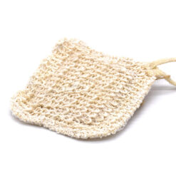 Close-up of sisal facial scrubby texture with hanging loop on a plain background