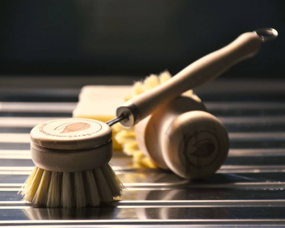 image of bamboo washing up brush, bamboo pot brush and solid washing up soap bar