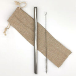 Reusable stainless steel boba straw with cleaning brush and cotton pouch on a white background