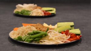 Image of two plates of gado gado