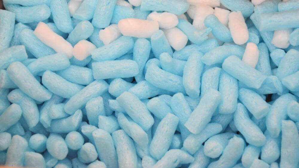 blue and white biodegradable plastic free packing peanuts made from starch material