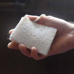 Jeremy cellulose sponge held in a hand to show size and texture