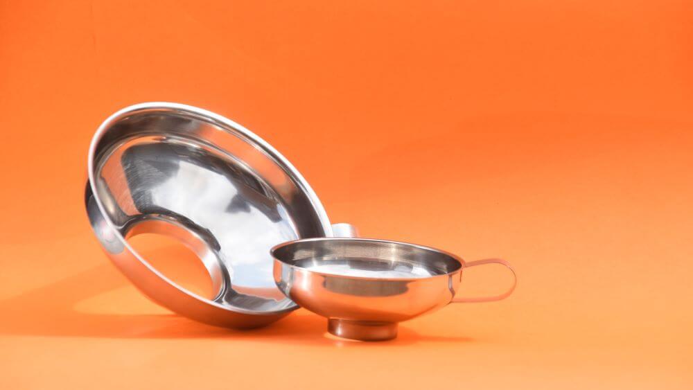 Image of a large and a small stainless steel funnel