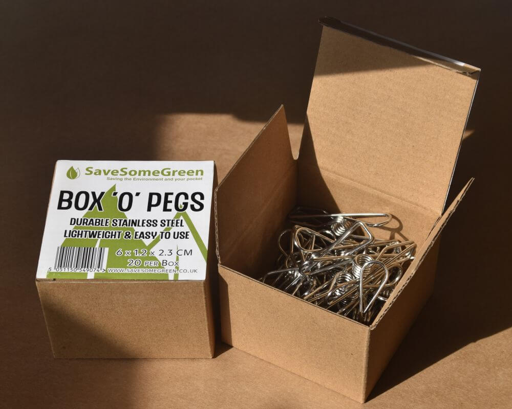 Image of two boxes with plastic free stainless steel pegs, one closed showing the label, the other one open to show the pegs.