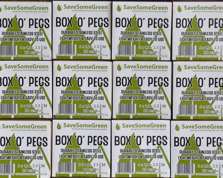Image of boxes with plastic free stainless steel peg being piled into three stacks of four rows, showing the label reading Save Some Green Box'O'Pegs.