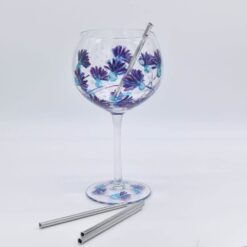 Stainless steel gin straw in a floral gin glass