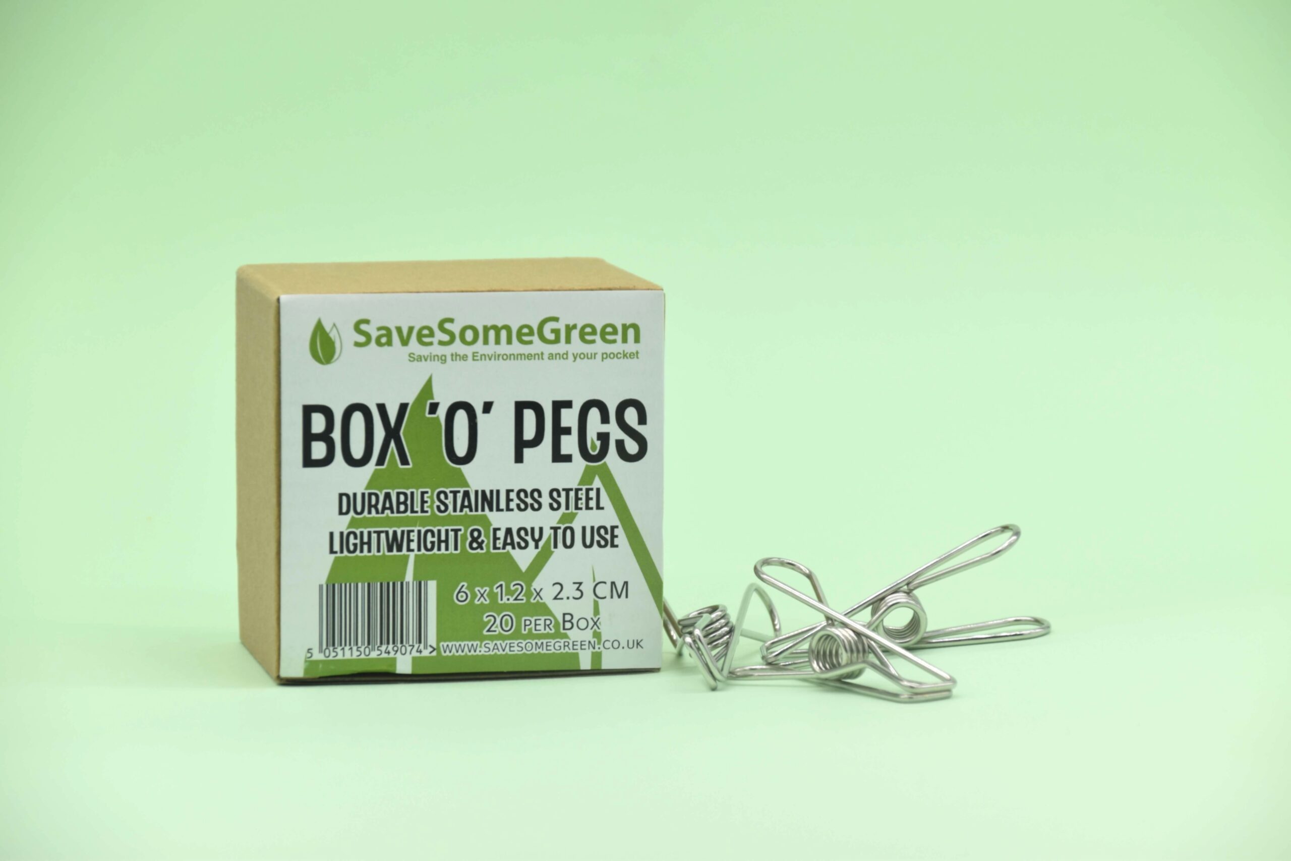 Image of a Save Some Green Box 'O' Pegs with three plastic free stainless steel pegs next to it, against a mint green background.